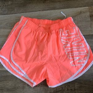 Neon orange Nike shorts